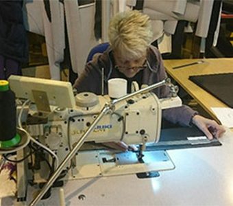 Woman Sewing Using Sewing Machine